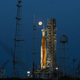 A full Moon is in view from Launch Complex 39B at NASA’s Kennedy Space Center in Florida on June 14, 2022 with the Artemis I Space Launch System (SLS) and Orion spacecraft, atop the mobile launcher.